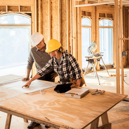 Couple looking at blue prints