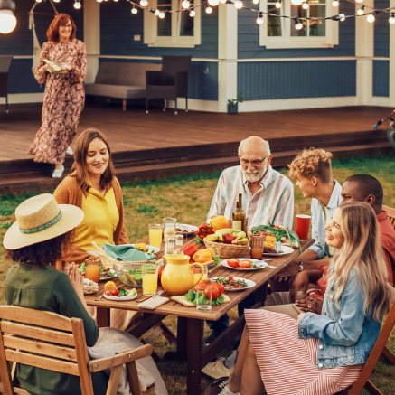 Family-enjoying-dinner-outside