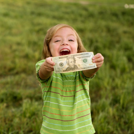 Little-girl-holding-money