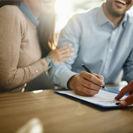 Smile and sign paperwork