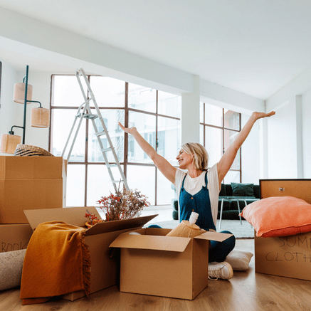 Woman moving into house with boxes